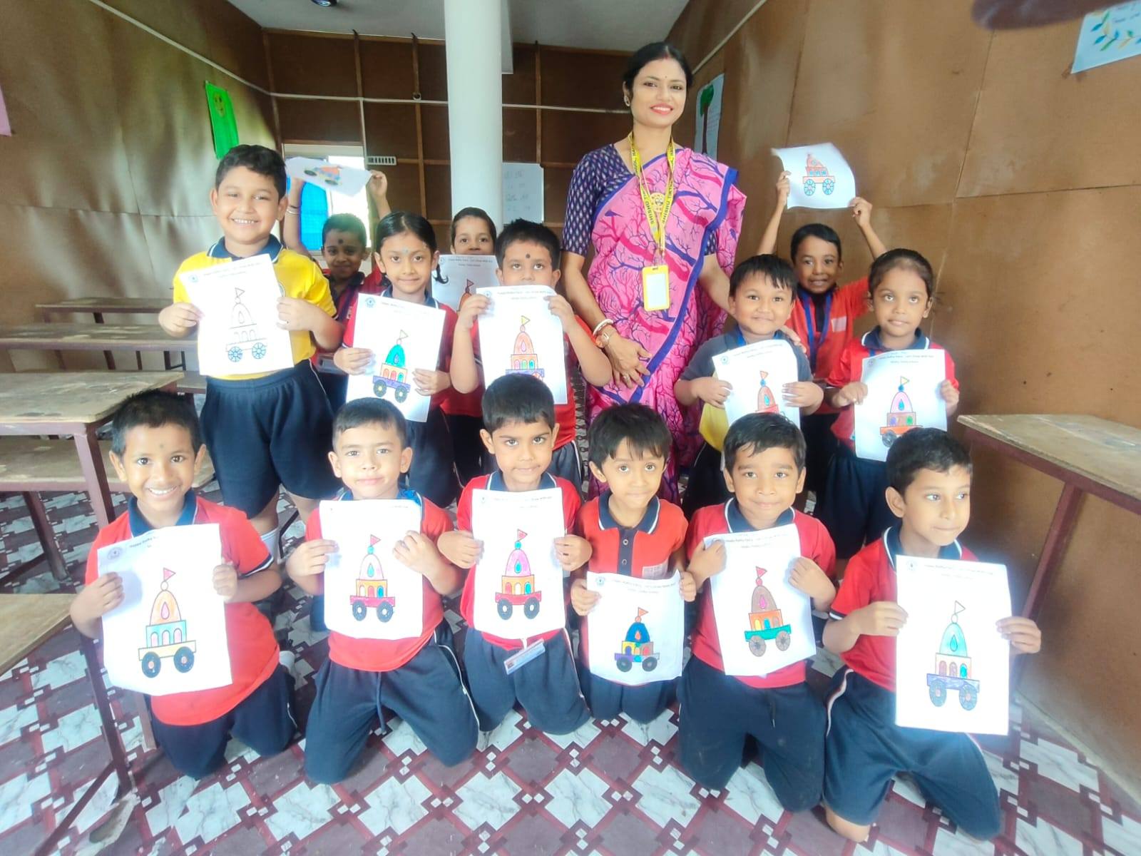 Children and teacher celebrating at Shishu Tirtha School, Halisahar