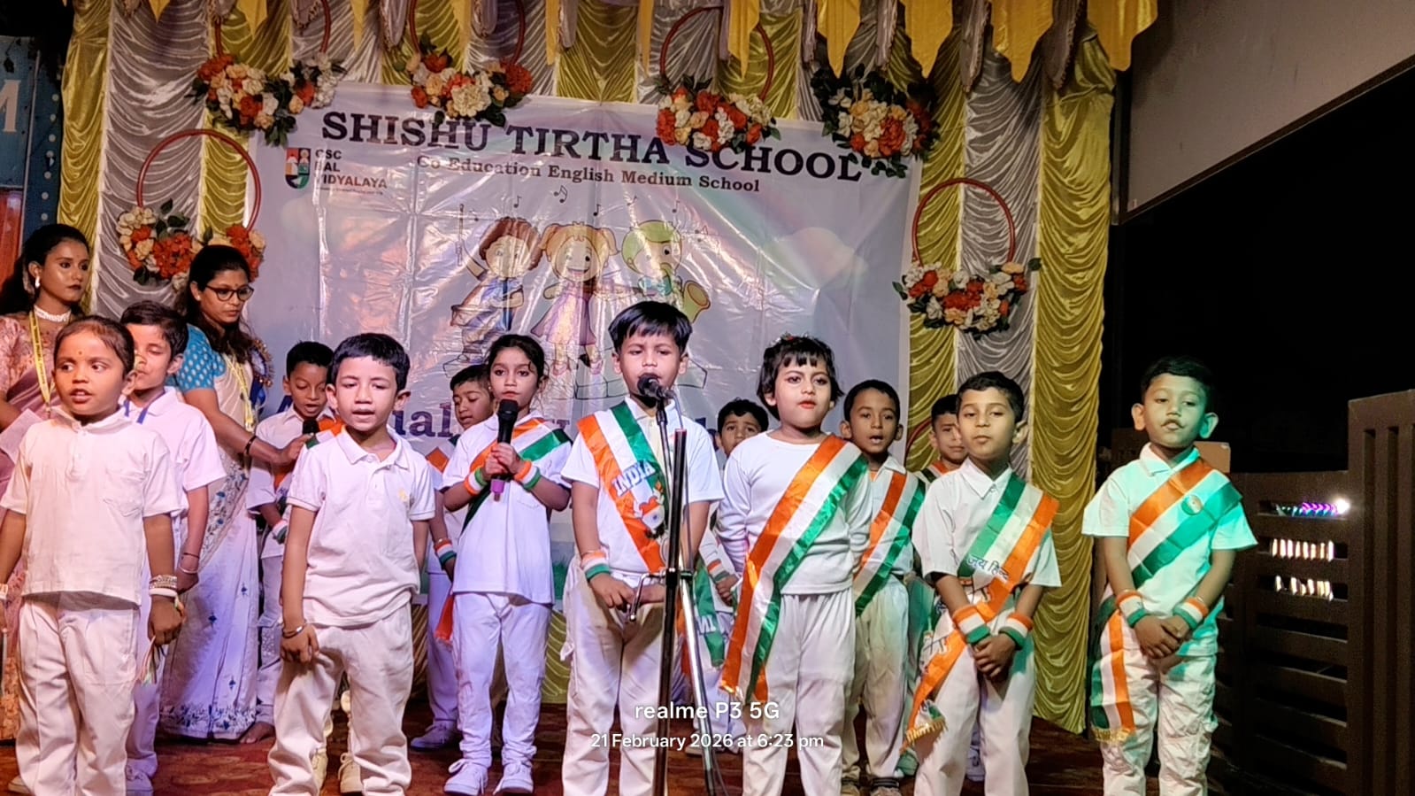 Students participating in a song performance in the annual programme